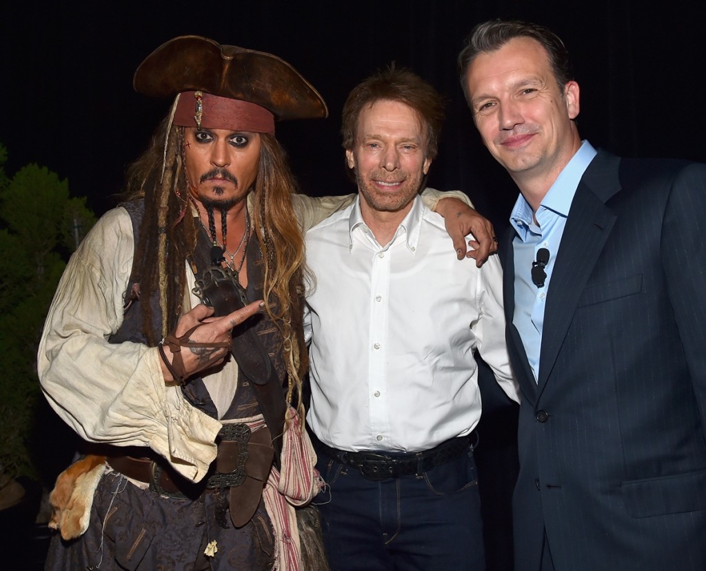 ANAHEIM, CA - AUGUST 15:  (L-R) Actor Johnny Depp, dressed as Captain Jack Sparrow and producer Jerry Bruckheimer of PIRATES OF THE CARIBBEAN: DEAD MEN TELL NO TALES with President of Walt Disney Studios Motion Picture Production Sean Bailey took part today in "Worlds, Galaxies, and Universes: Live Action at The Walt Disney Studios" presentation at Disney's D23 EXPO 2015 in Anaheim, Calif.  (Photo by Alberto E. Rodriguez/Getty Images for Disney) *** Local Caption *** Johnny Depp; Sean Bailey; Jerry Bruckheimer